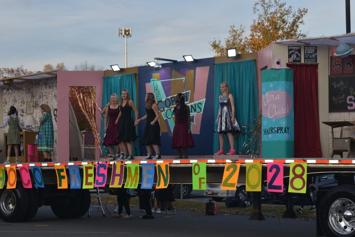 Class of '28 float participants show off a small routine as part of their Hairspray skit. 