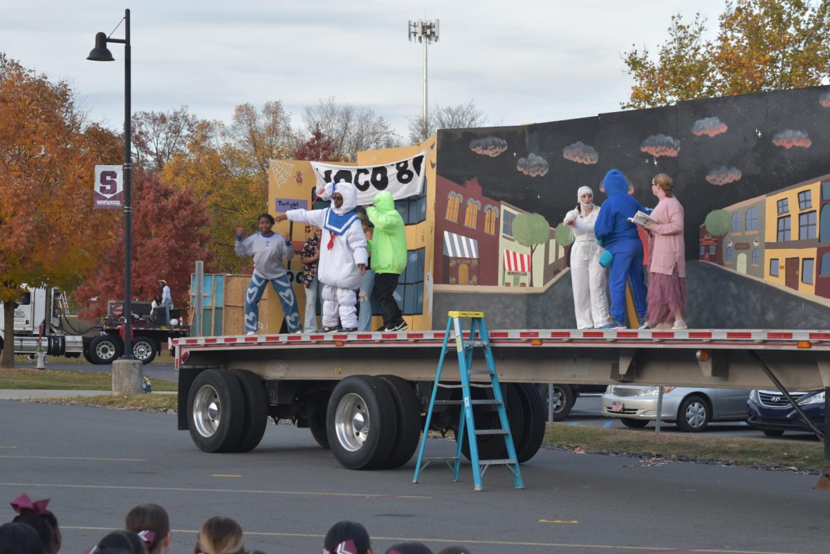 Luma Rowashda, '26, Caitlin Hoffman, '26, Julia Grant, '26, Kingston Jones, '26, and NAME, '26 dress as ghosts like Slimer and Marshmallow Man from Ghostbusters. 