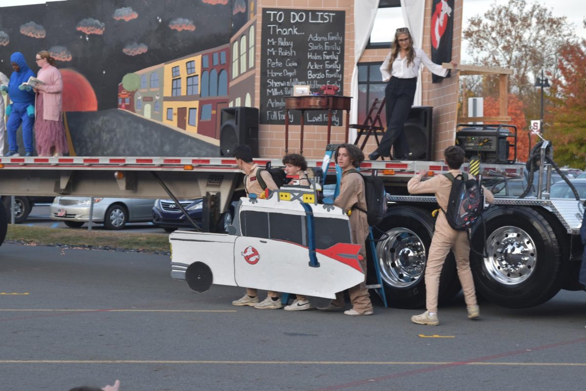 Lucas Pelaez, '26, Otti Maioriello, '26, Matteo Maccarrone, '26, and Shaun Evans, '26 dress in the classic uniform of  the Ghostbusters. 