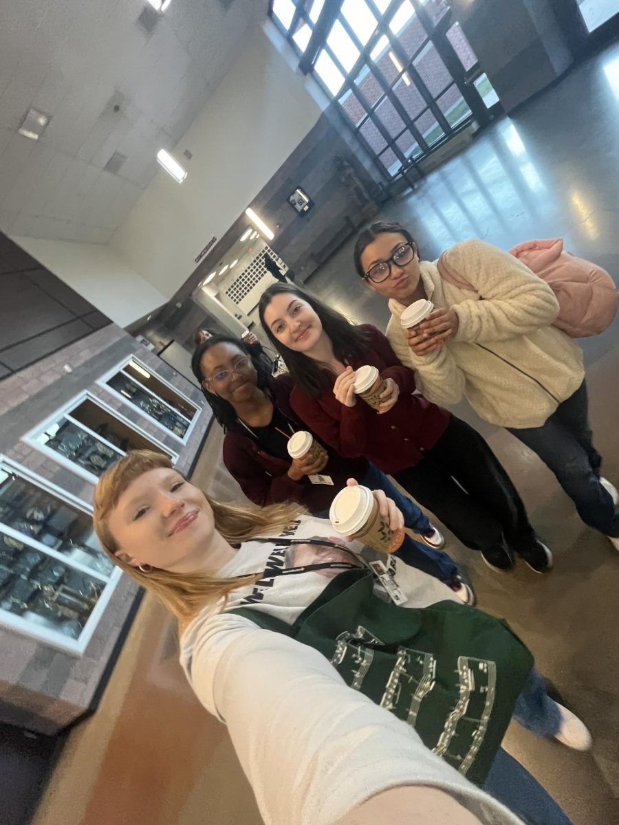 Crista Kopec, Lile Bekaia, Hailey Abba, and Isabella Rivera posing for a selfie with hot chocolate.