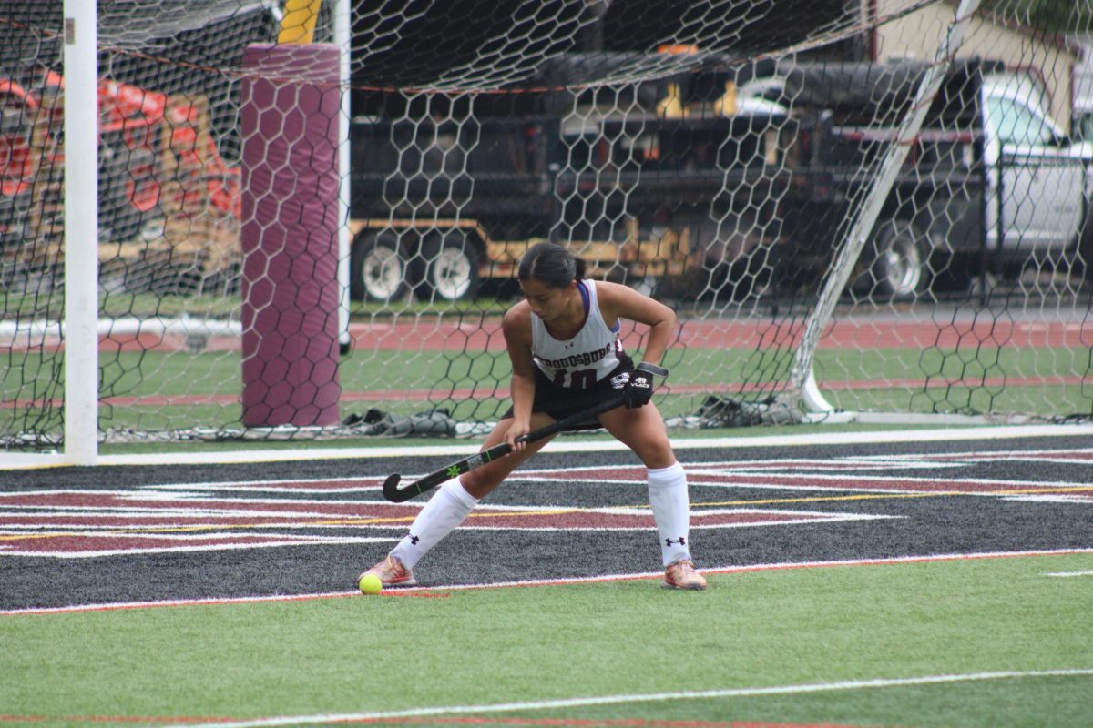 Leanna Neri, '27 setting the ball to put it into play.