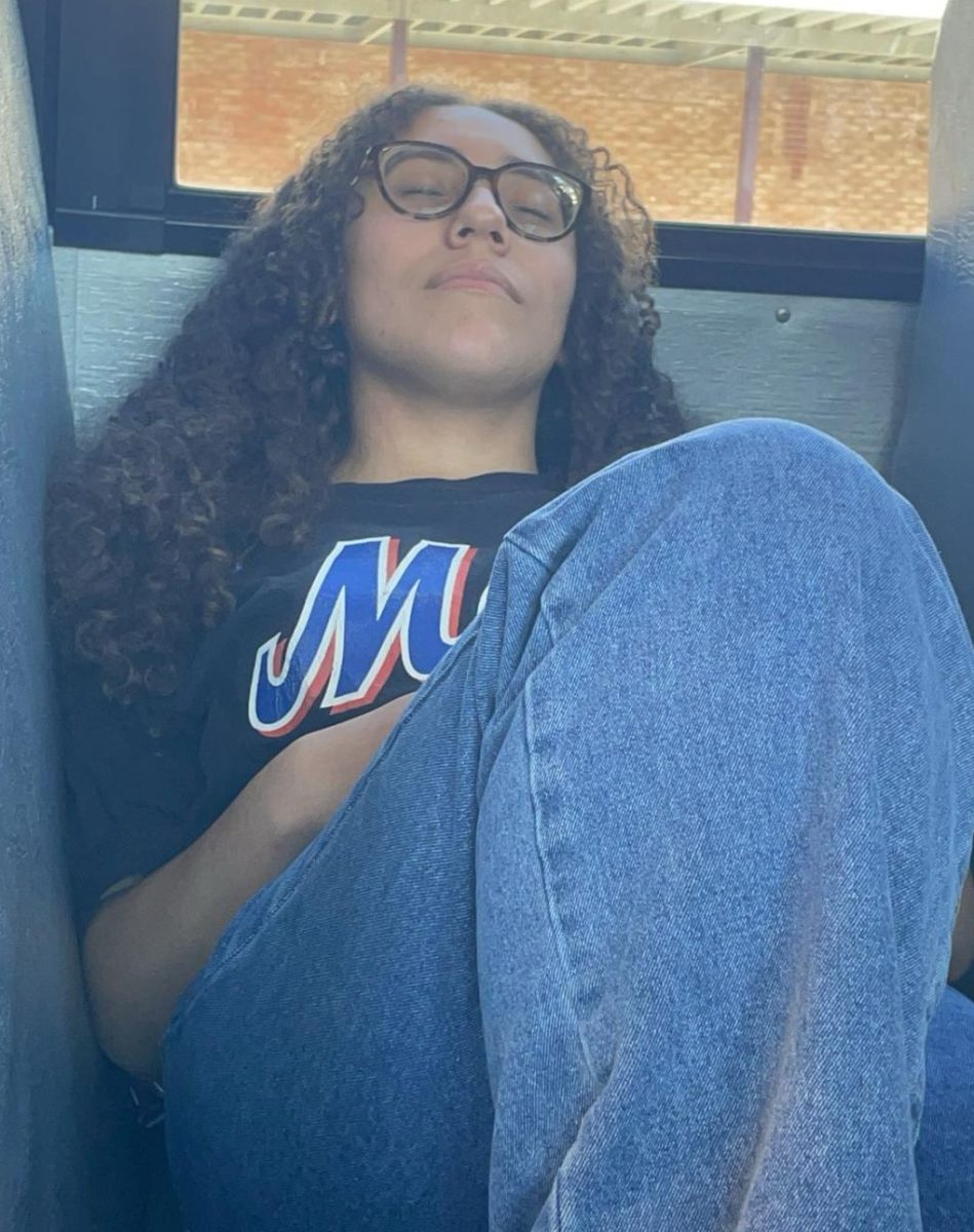 SHS student  Kiara Camacho, '25, sleeping on the bus after a long day at school. 