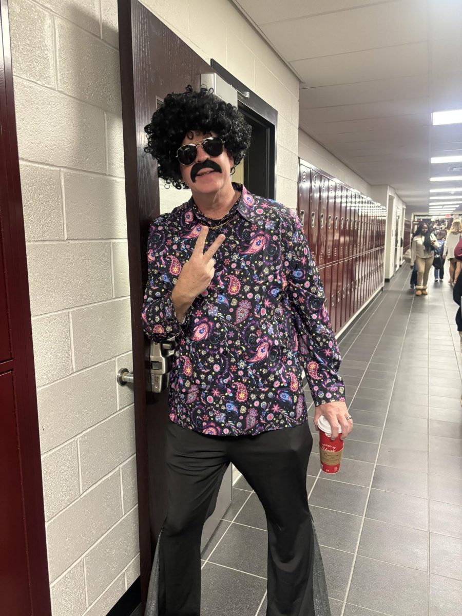 Mr. Doney poses in his best 70s outfit for Disco Day during Homecoming Spirit Week. 