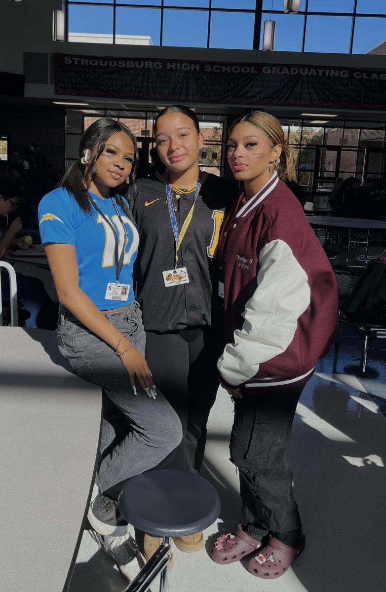 Katliyn trahaera '25, Zsiani Findley '25, and Briana vasquez '25 dressed for Mathlete vs. Athlete