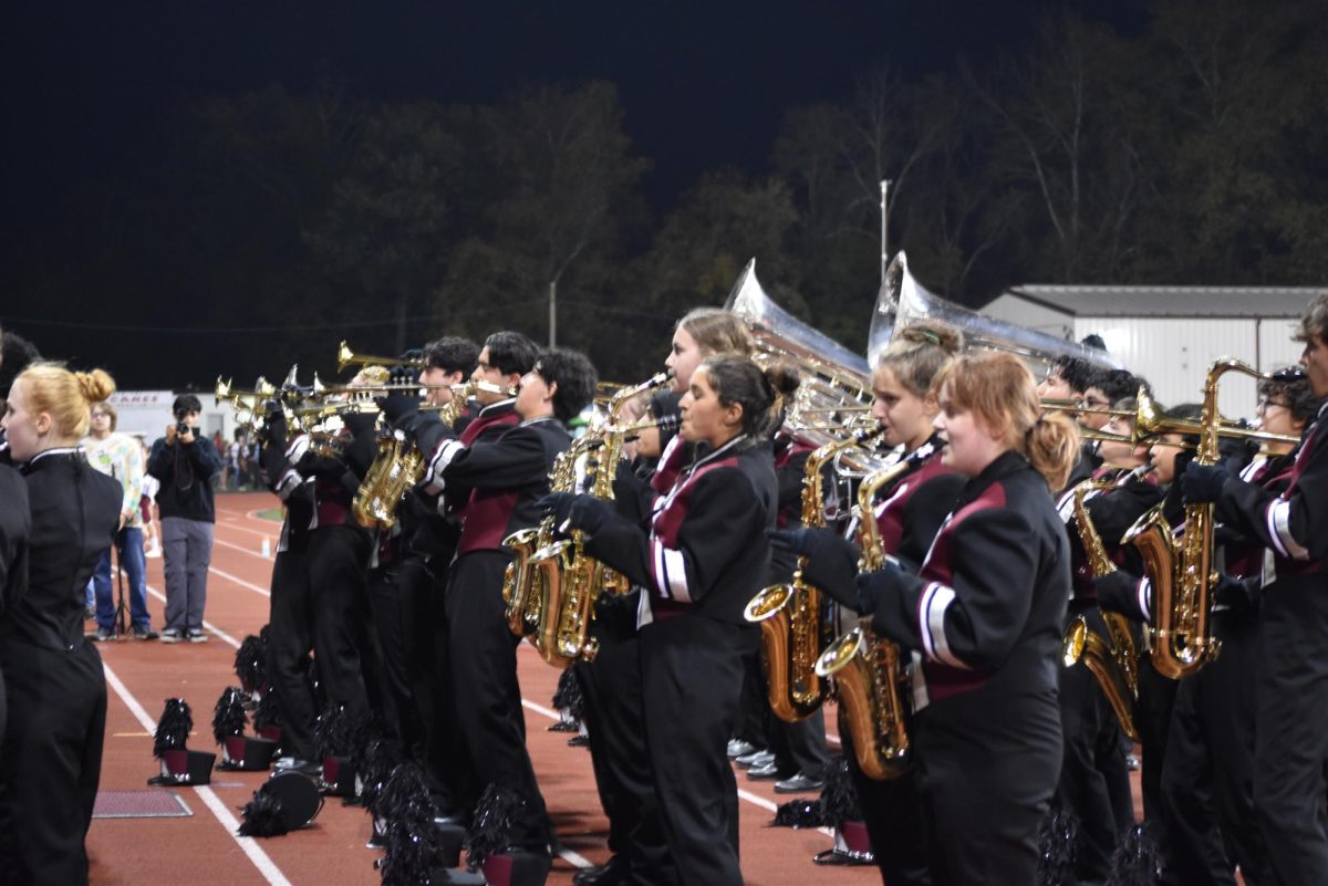 Stroudsburg Marching Band rushes to the front of the stands to perform "Over the Rainbow" at the end of their halftime show.