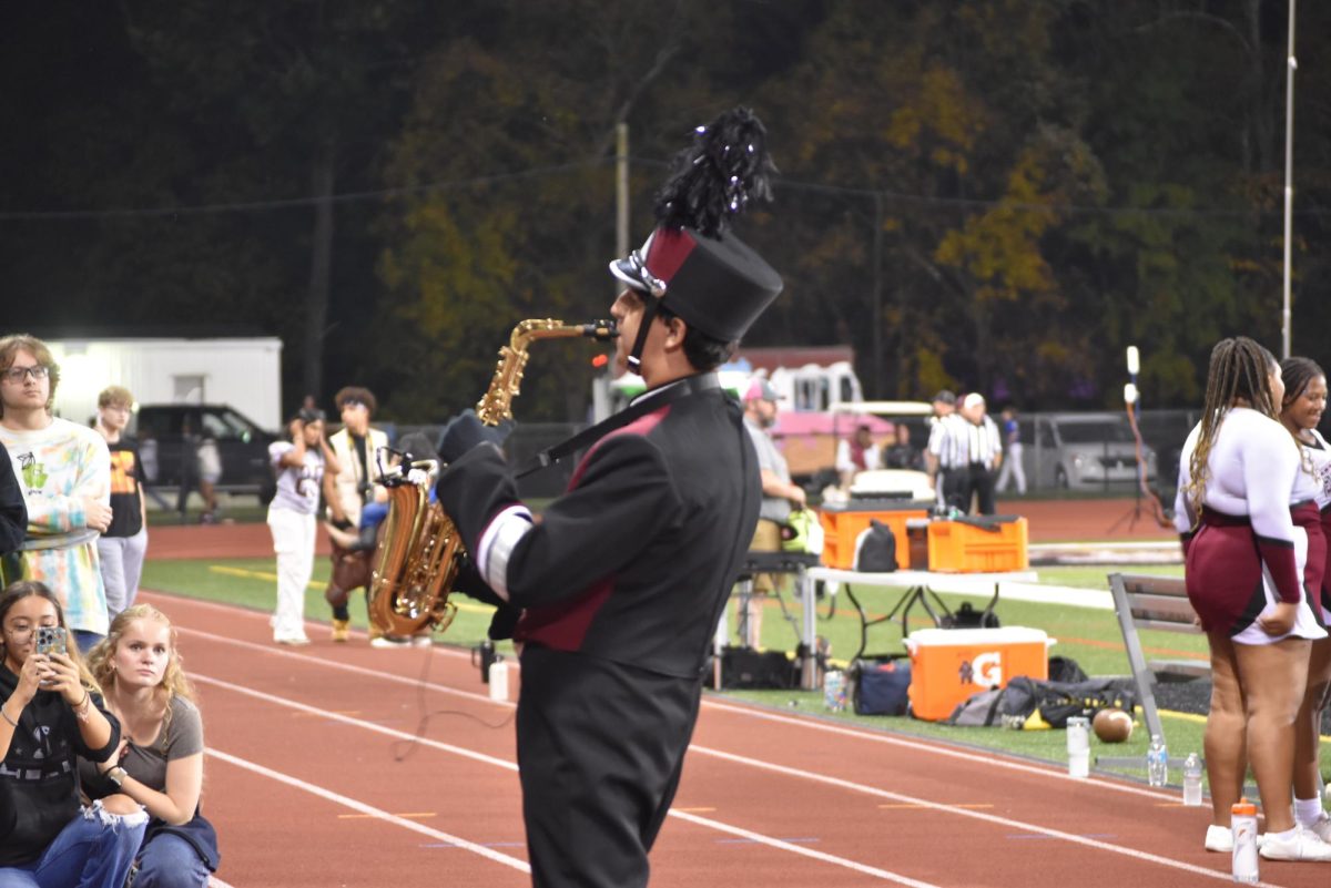 Kona Maronpot, '25, performs his solo during "Over the Rainbow" at the band's halftime show.