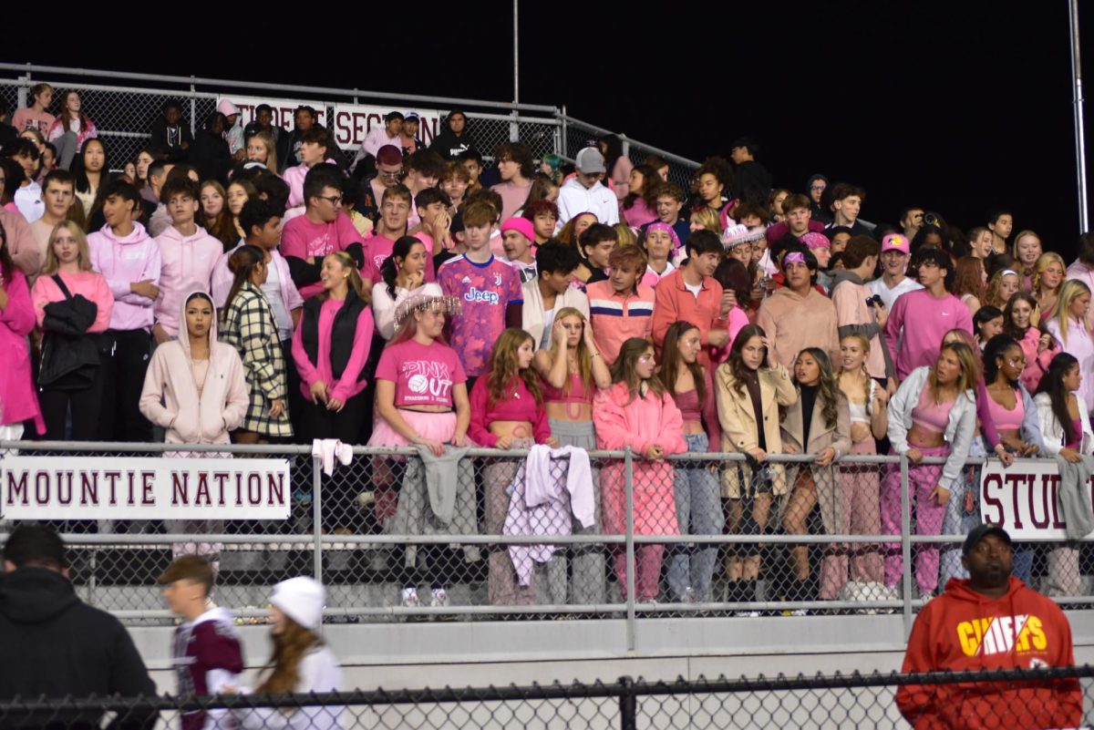 The Mountie Maniacs dress in all pink for the exciting game against Pleasant Valley.