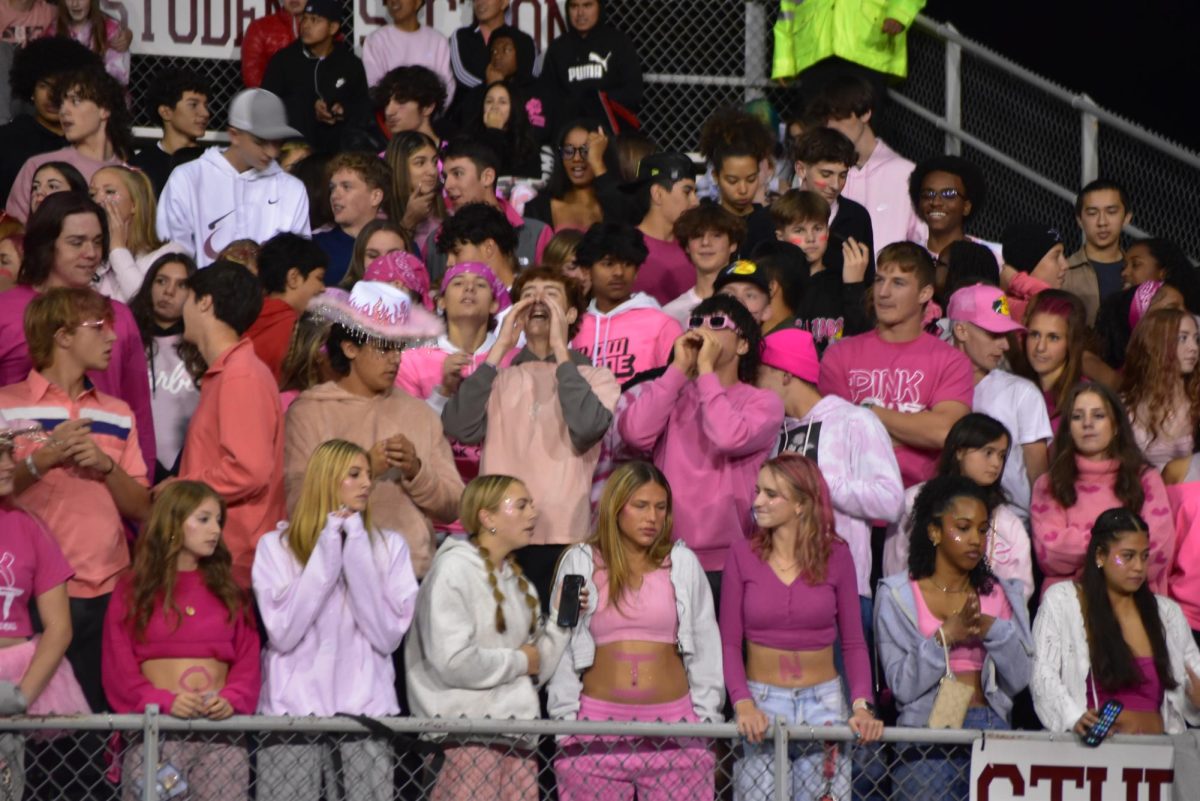 Gavin Bunn, ´25 helps lead the SHS student section in cheering and chants. 