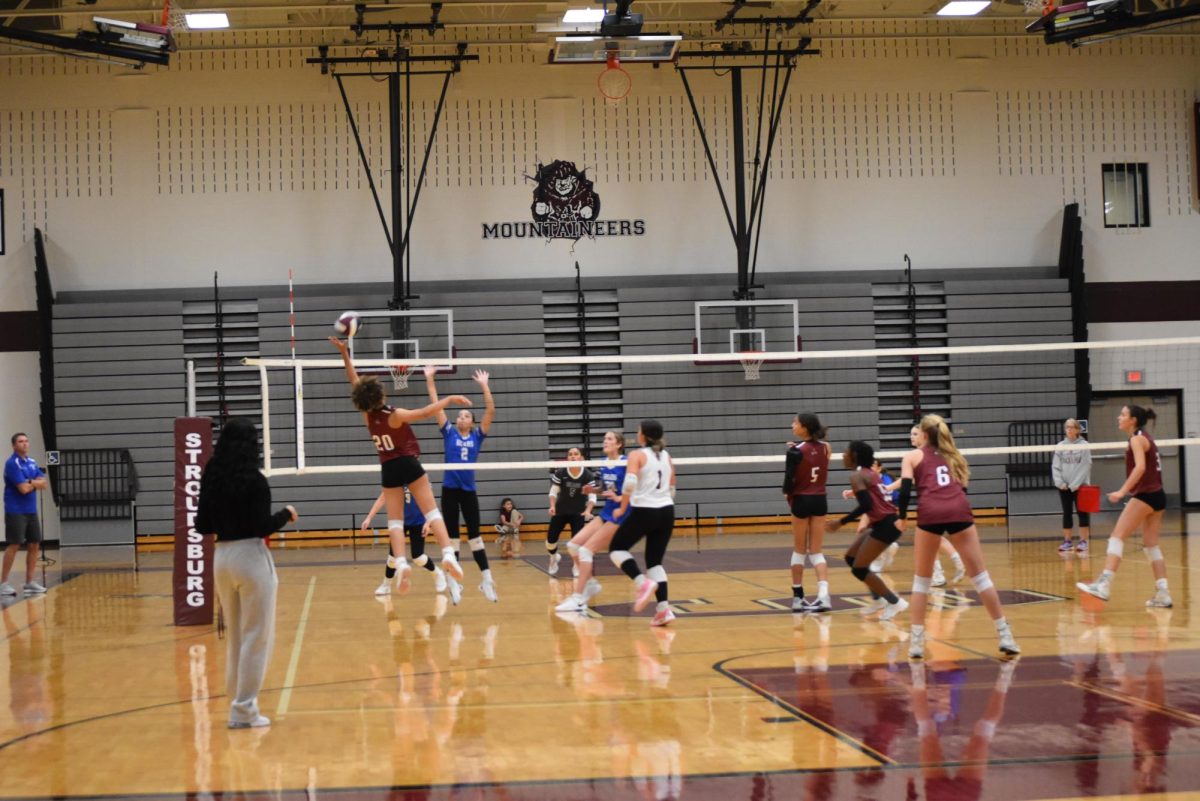 Cotoria McCarthy, '26 tips the ball to trip up the Pleasant Valley team.