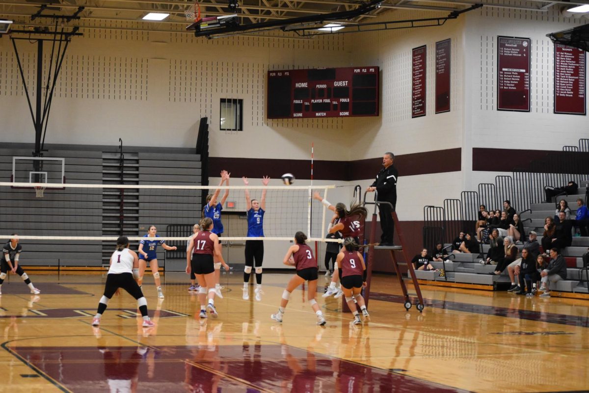 Melanie Barbaran, '26 attacking the ball in a game against Pleasant Valley.