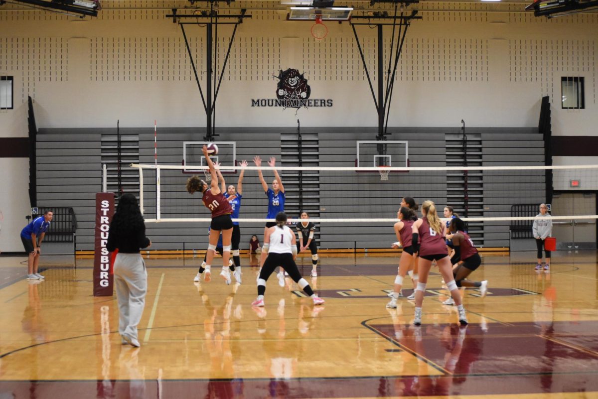 Cotoria McCarthy '26 spiking against the Bears