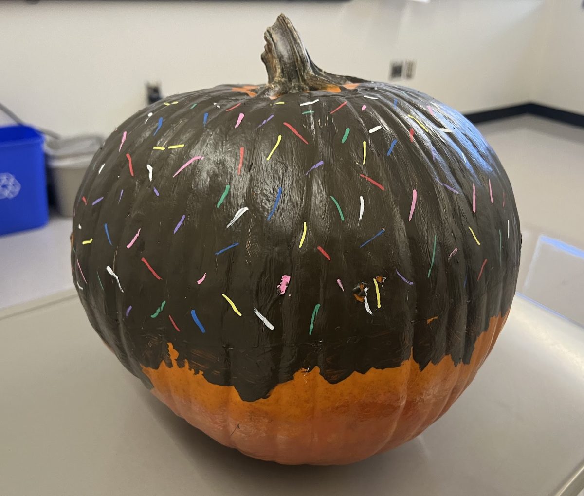 Mrs. DeMartino painted impressionism inspired pumpkin. Donut or Cake pop?