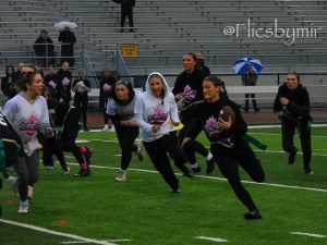 Sydney Moritz, '25, running the ball towards the end zone during the Annual PowderPuff game.