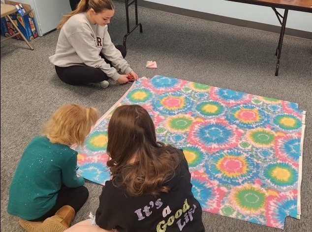 Rebecca Dishong volunteers at Zion United Church of Christ, teaching Sunday school to elementary school students, making blankets.