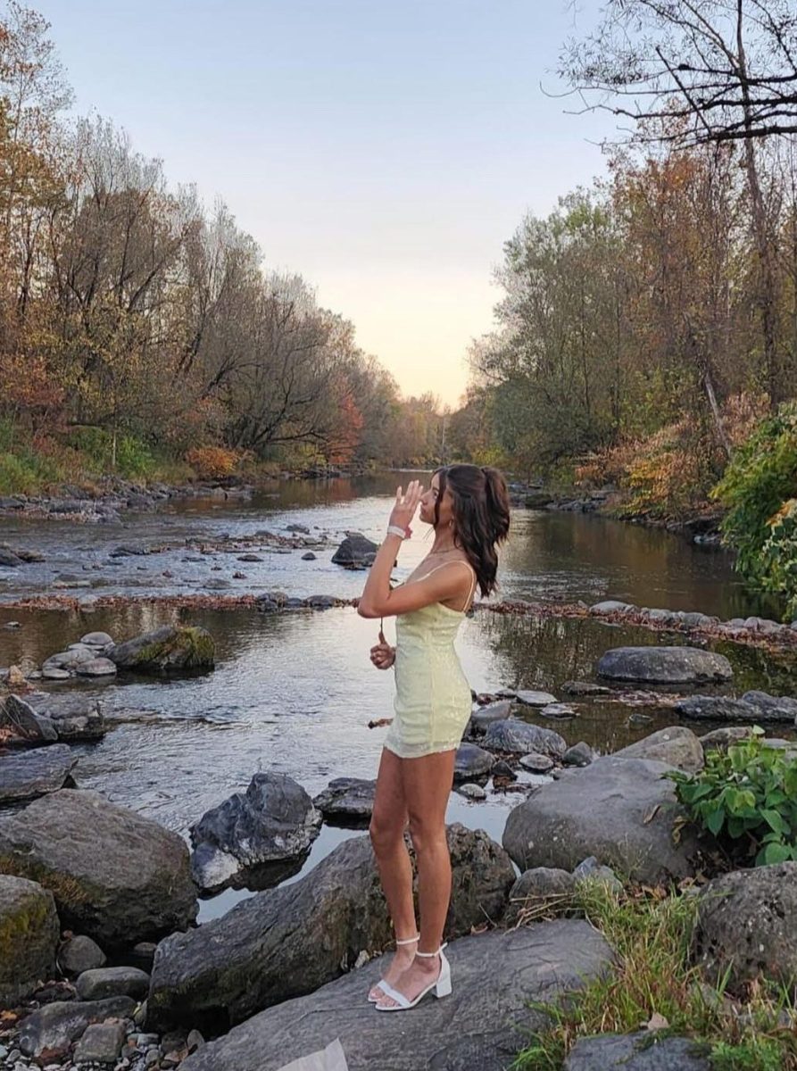 Student Madelyn Vargas posing in front of a beautiful, scenic lake. Photo shared Madelyn Vargas. 