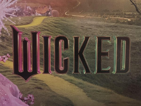 The "Wicked" movie logo which can be found on various posters and billboards.