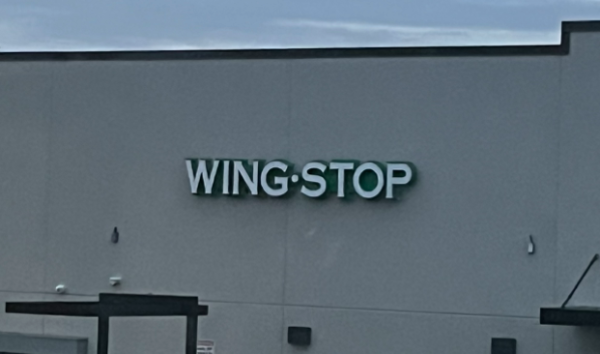 Wingstop being constructed in-between T-Mobile and Starbucks