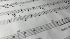 A close up of music  notes from "The Adams Family" musical. 