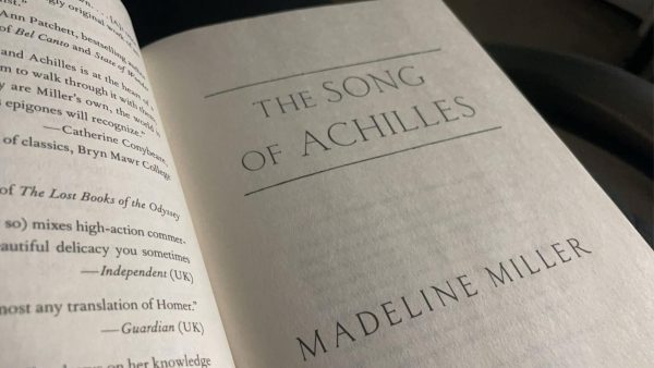 The "The Song of Achilles" by Madeline Miller opened to the title page. 