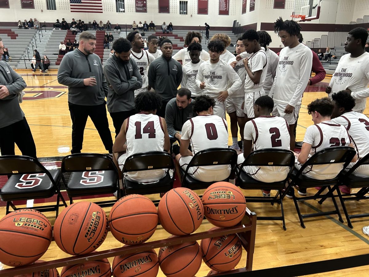 Stroudsburg in team huddle during timeout during game against Pocono Mountain East on December 3, 2024.