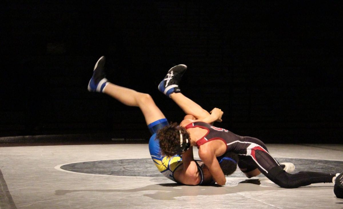 Albert Bialasiewicz, '26, taking down his opponent during the William Allen match.