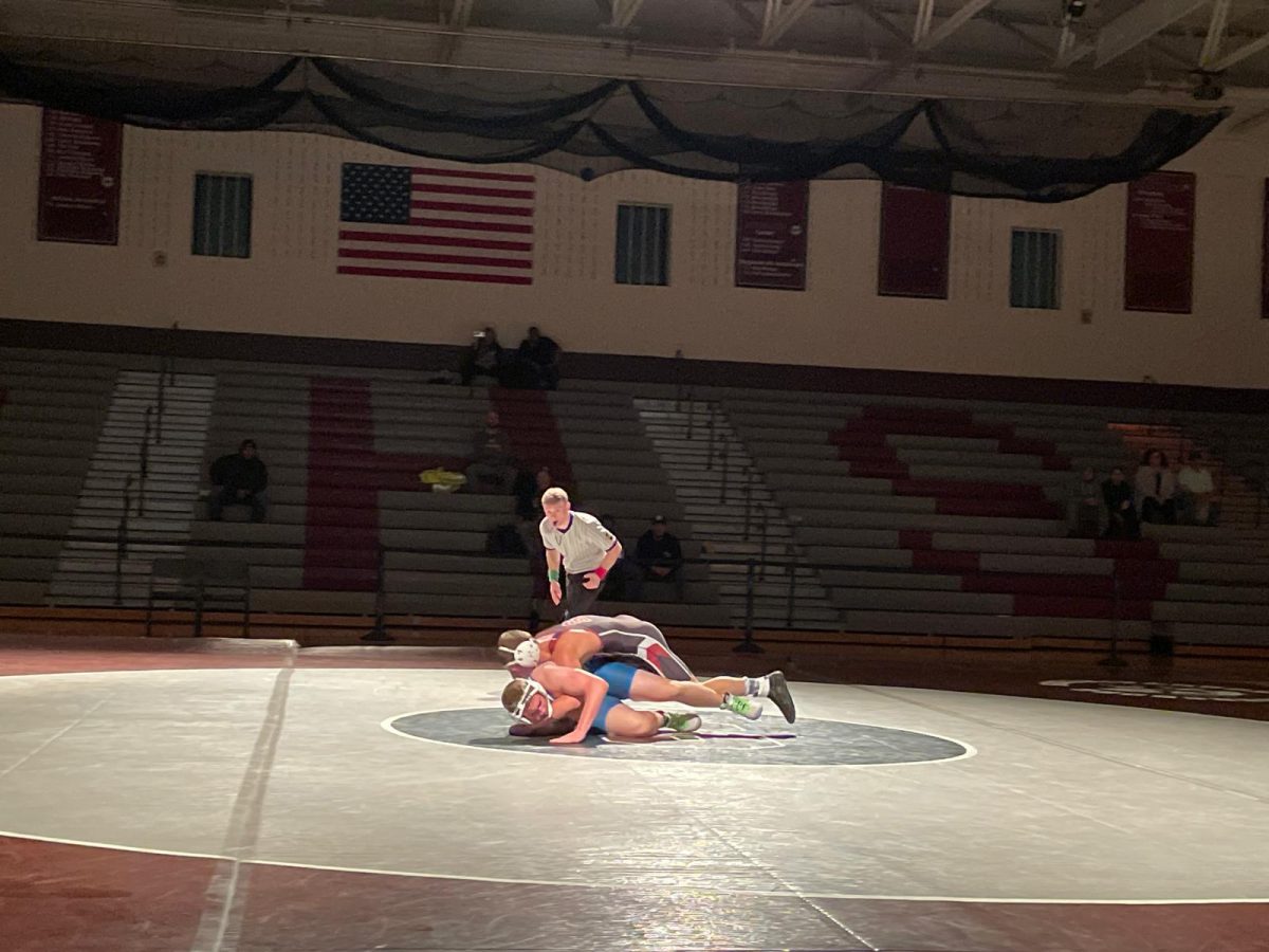 Lenny De Maria, '27, fighting against his opponent from William Allen High School.