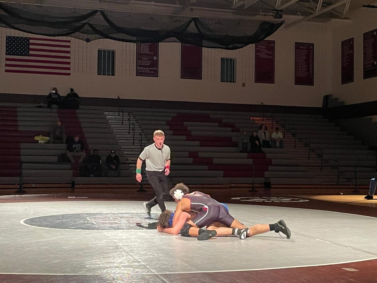 Giovanni Alvarez, '27, pinning his opponent from William Allen High School.