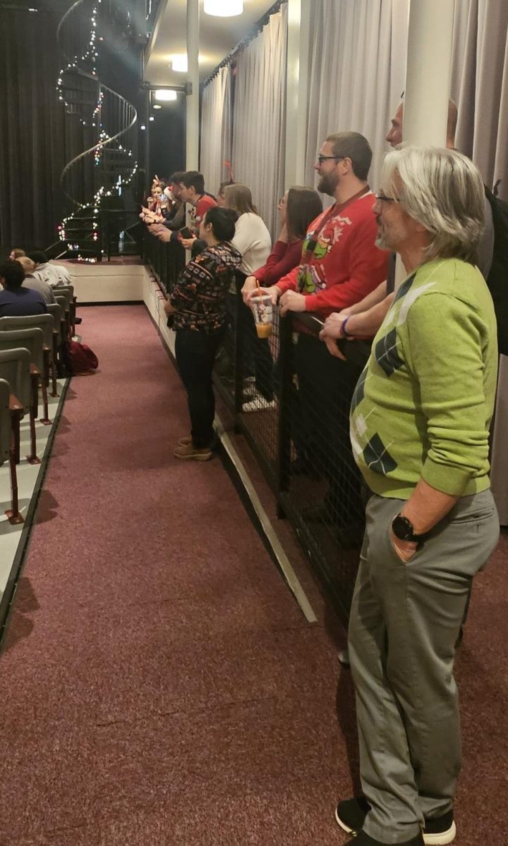 Faculty and staff lined the wings watching and also waiting to perform. 