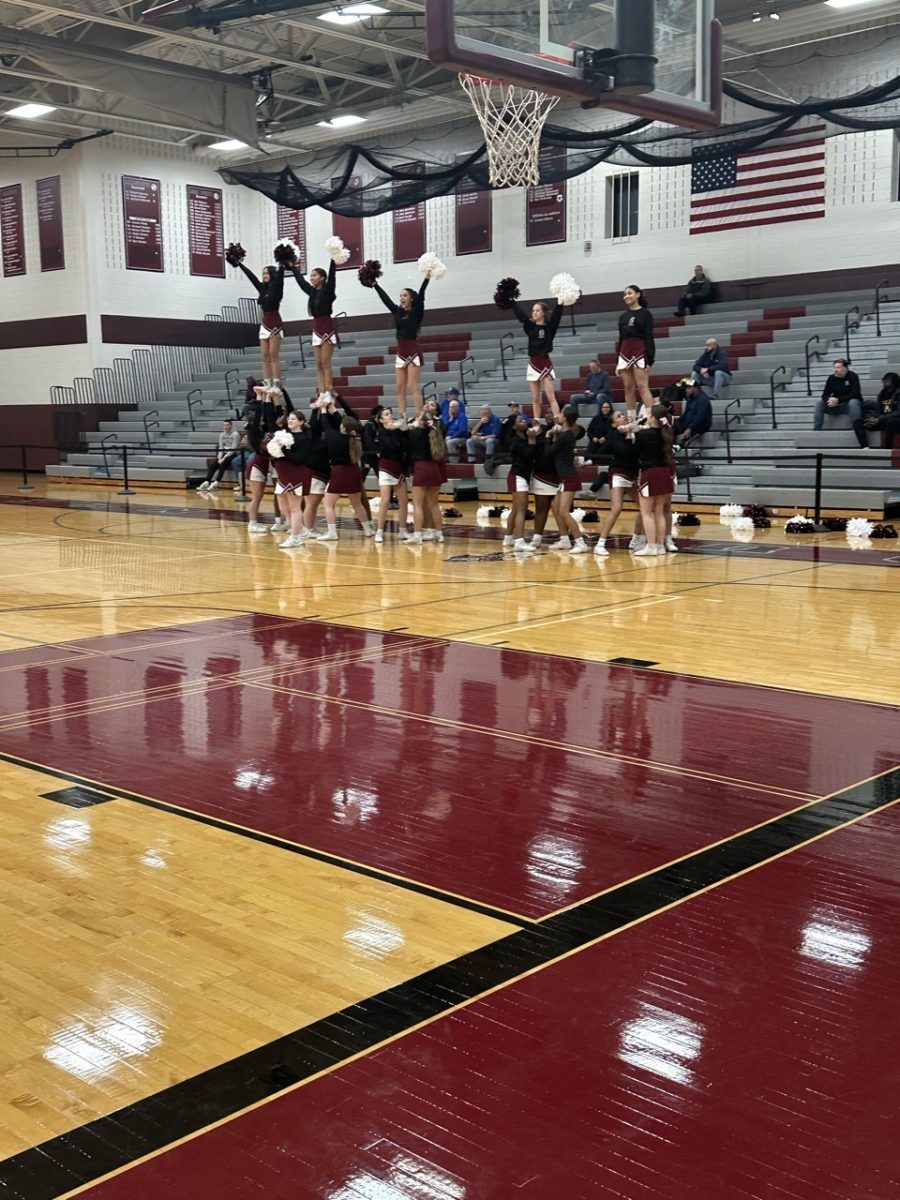 SHS cheerleaders stunt during halftime impressing the student body. 