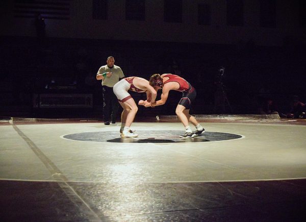 Ilya Ogden, '25, wrestling with his opponent from Northampton High School.