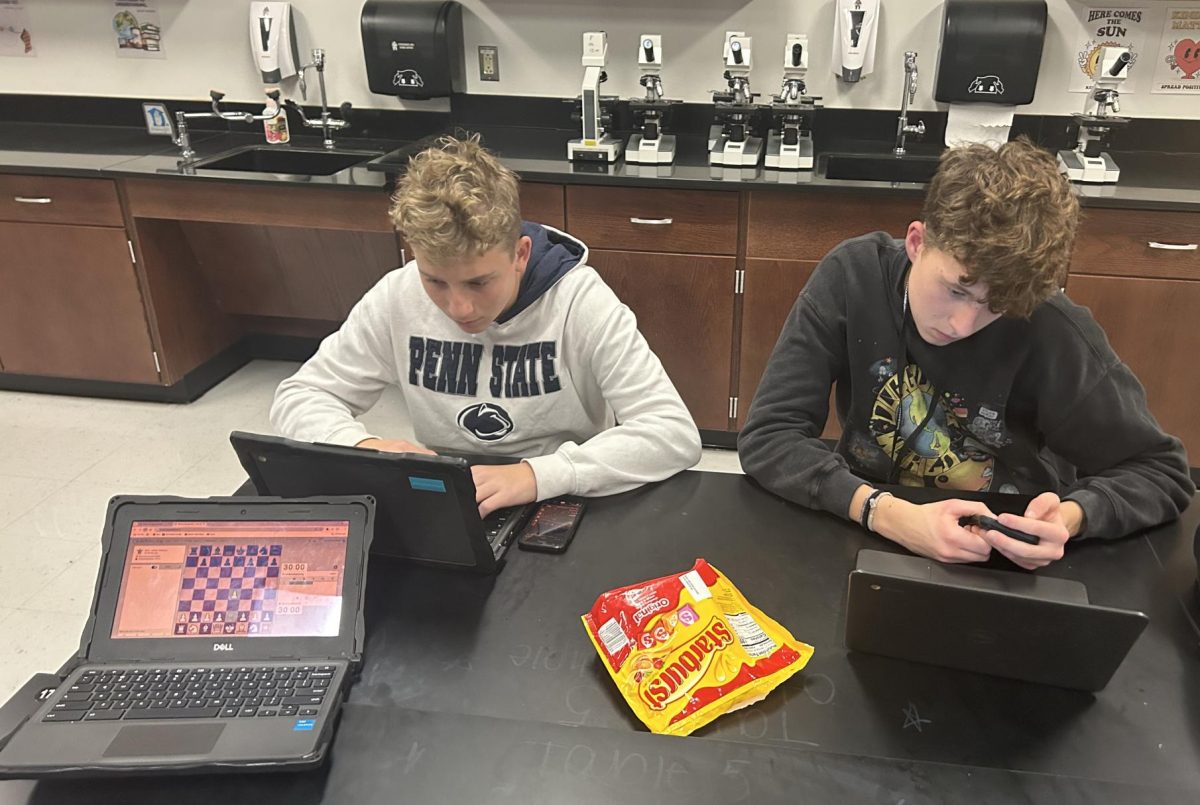 Mason Ulmer, ‘27, and Jacob Bajek, ‘25, preparing for their chess match against East Stroudsburg South