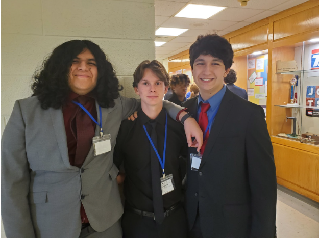 Dante Velez, Maxsim Lamberton, and Kona Maronpot, waiting for Tech Problem Solving to begin.
