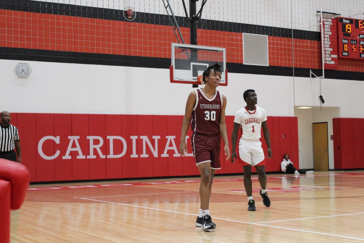 Marvin Dorvilus, '25, getting back on defense.