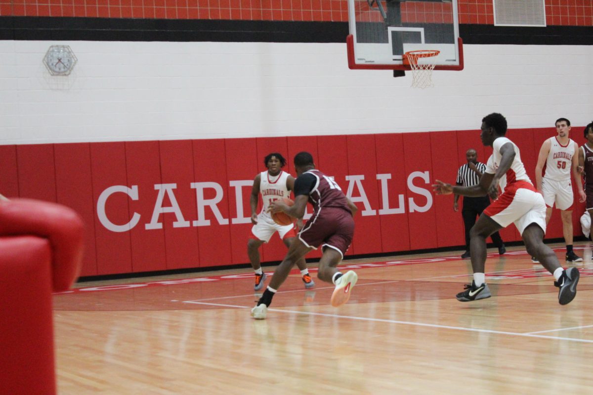 Josh Ivers-Green, '27, making a move towards the basket against Pocono Mountain East.