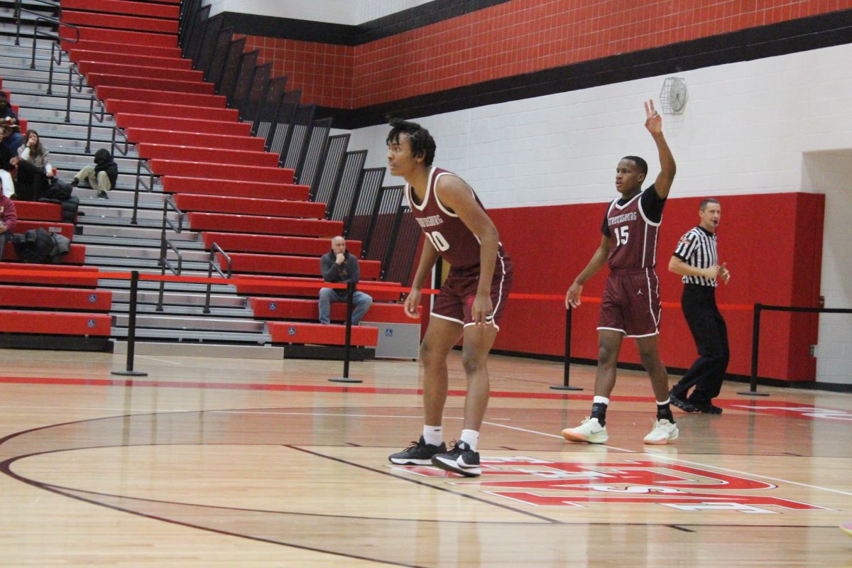 Josh Ivers-Green, '27, and Marvin Dorvilus, '25, calling defensive plays