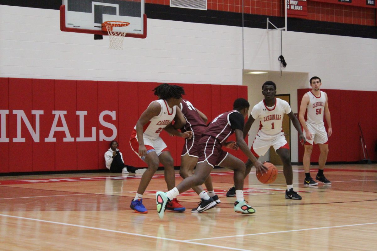 Jarel Jackson, '27, and Marvin Dorvilus, '25, moving on a pick-and-roll