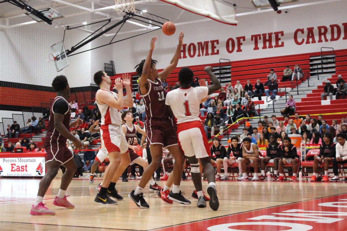 Marvin Dorvilus, '25, 'catching the ball, in order to make a move, against Pocono Mountain East.