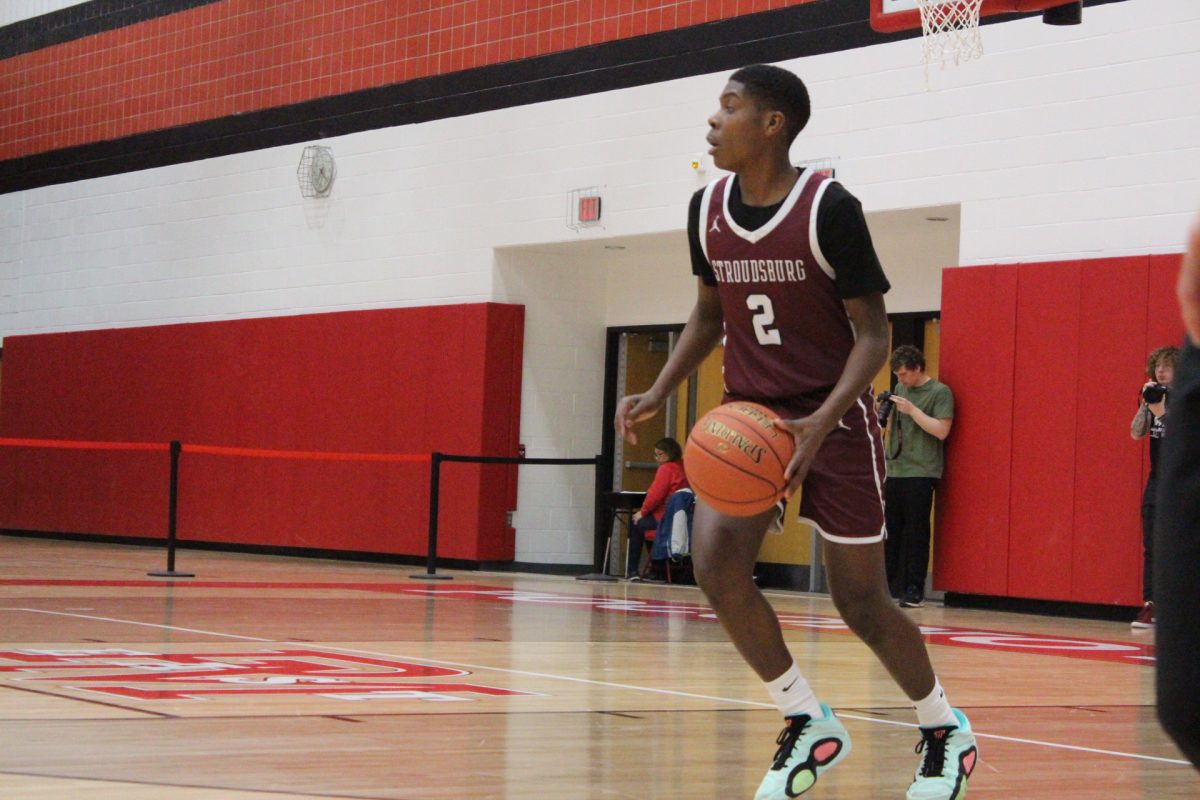 SHS guard, Jarel Jackson, '27, takes the ball up the court against East Stroudsburg North.