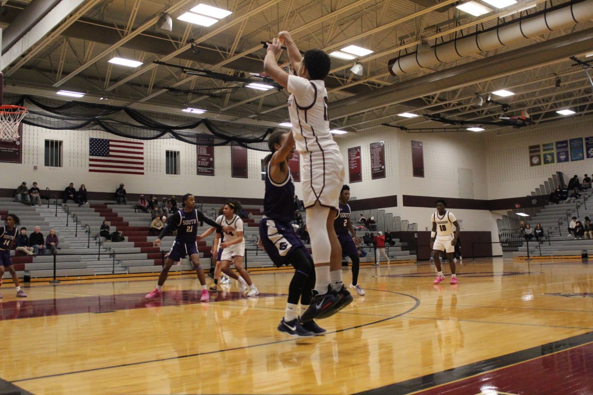 Deon Davis, '26, making a 3-pointer.