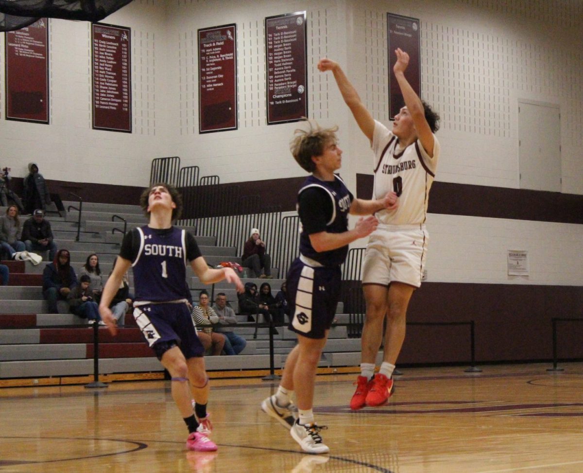 Stroudsburg's varsity player, Alex Pacitti, '25, makes a 3-pointer against East Stroudsburg South.