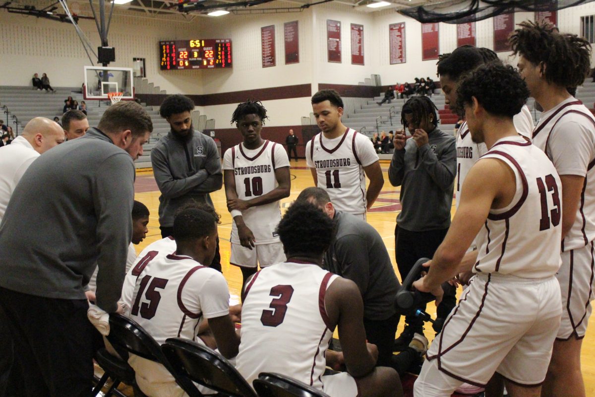 The Stroudsburg basketball team talking during the timeout