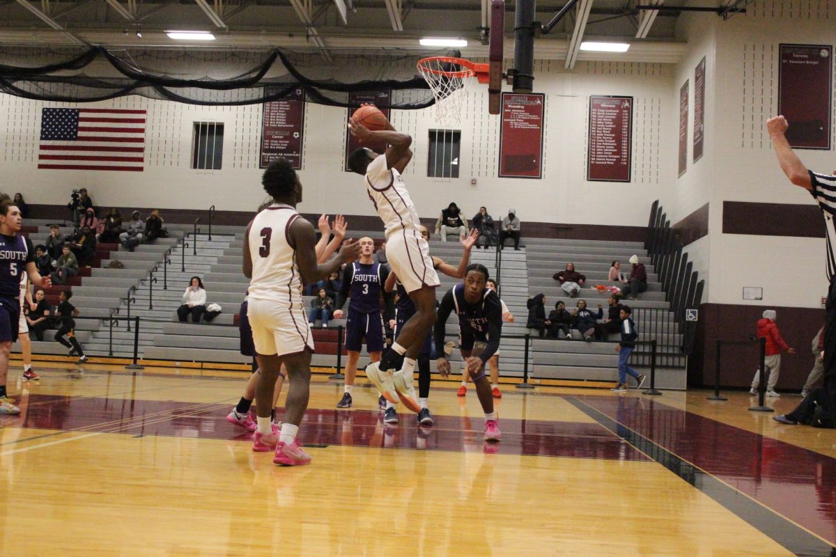 Josh Ivers-Green, '27, prepares to dunk the ball.