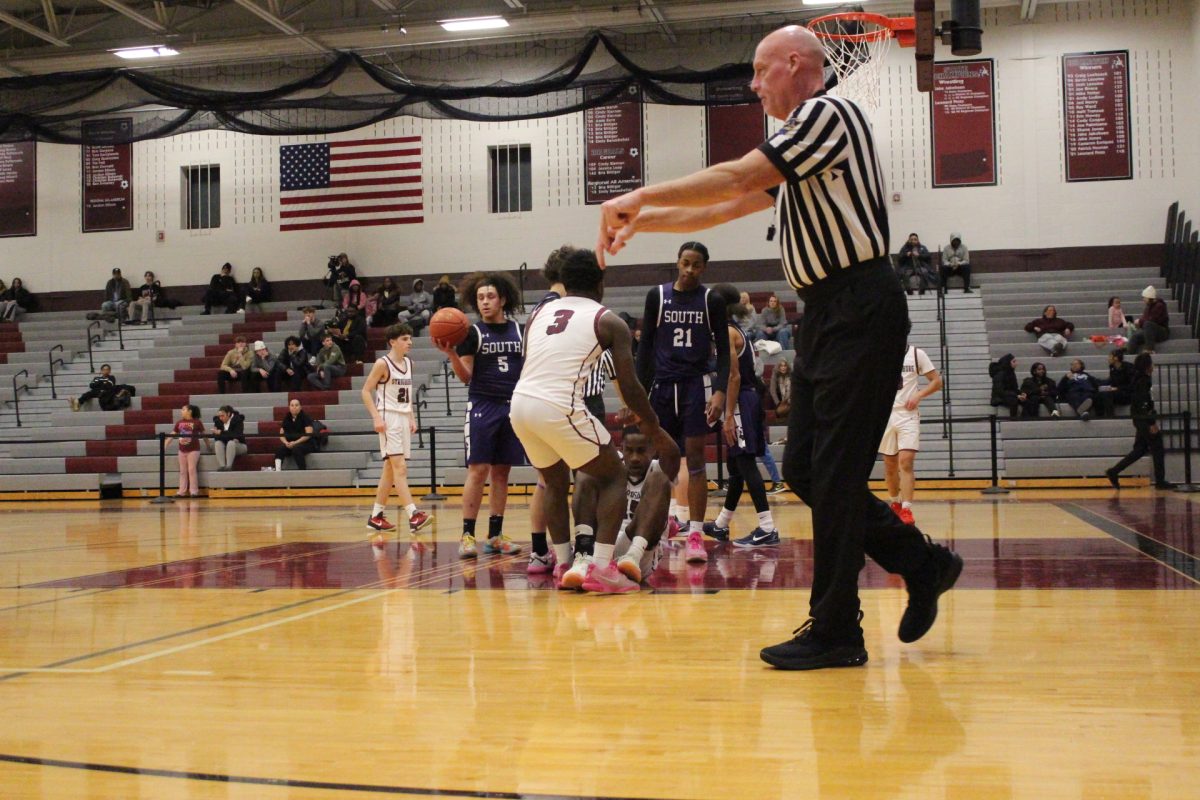 Kam Knight, '26, helps up Josh Ivers-Green, '27.