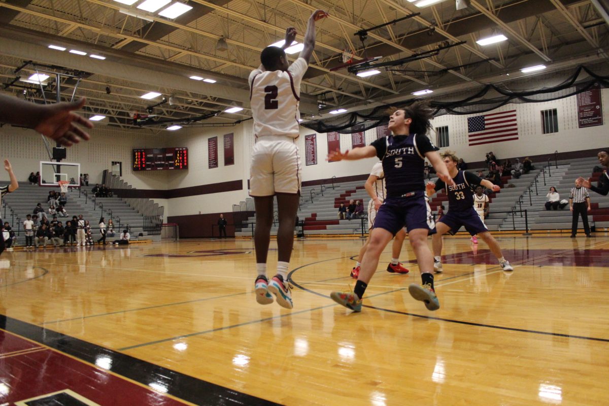 Jarel Jackson, '27, making a three pointer