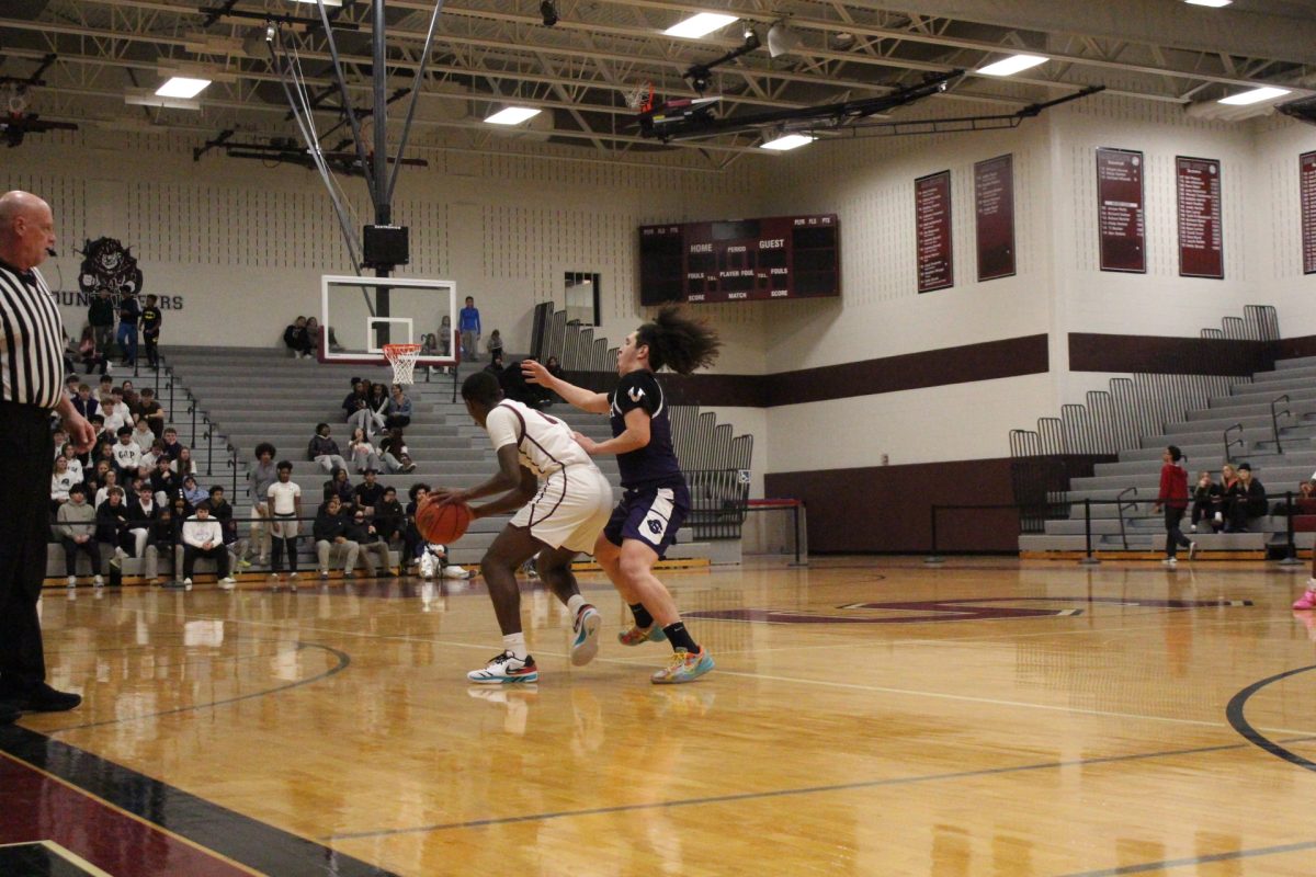 Jarel Jackson, '27, making a move on his defender