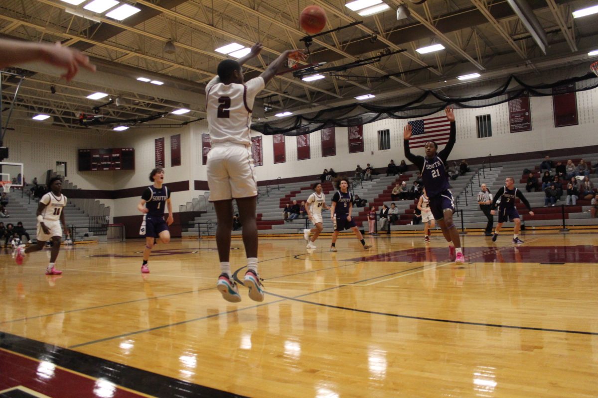 Jarel Jackson, '27, shooting a three pointer