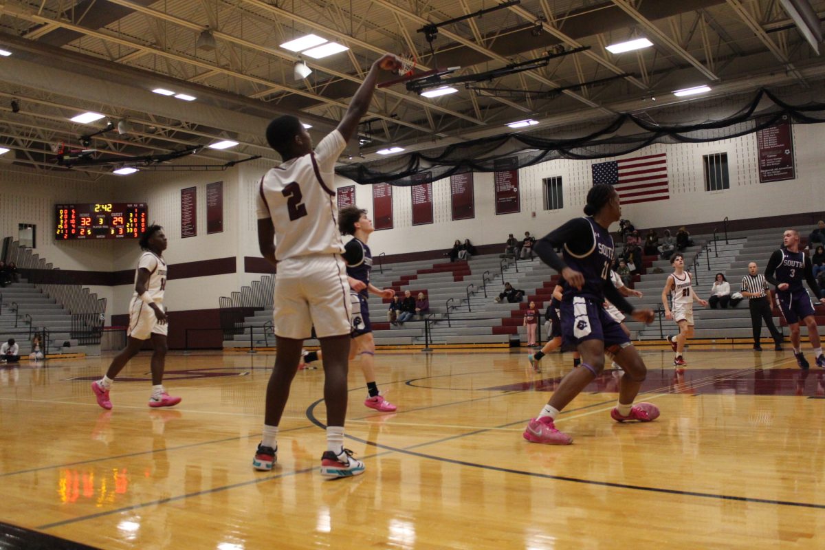 Jarel Jackson, '27, making a 3-pointer.