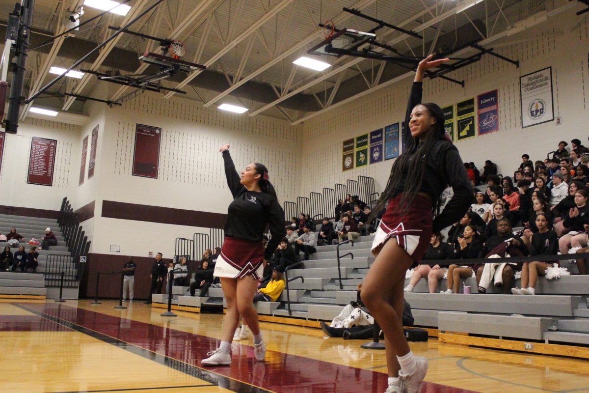 The cheerleaders celebrate after 2 consecutive free throws.