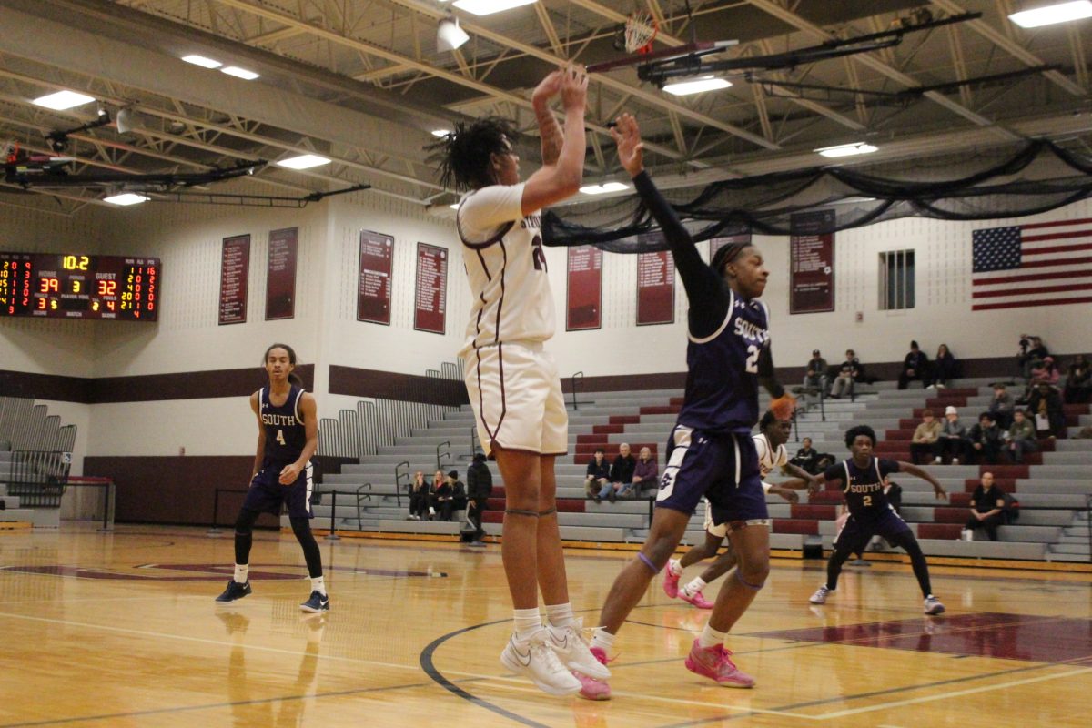 Marquise Long, '26, shooting a three pointer