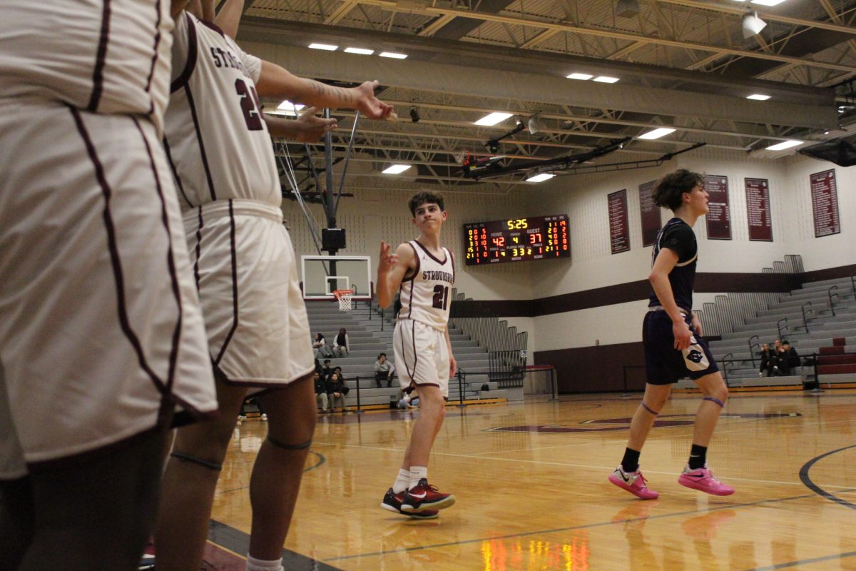 Tae El-Bassiouni, '28, celebrating his 3- pointer.